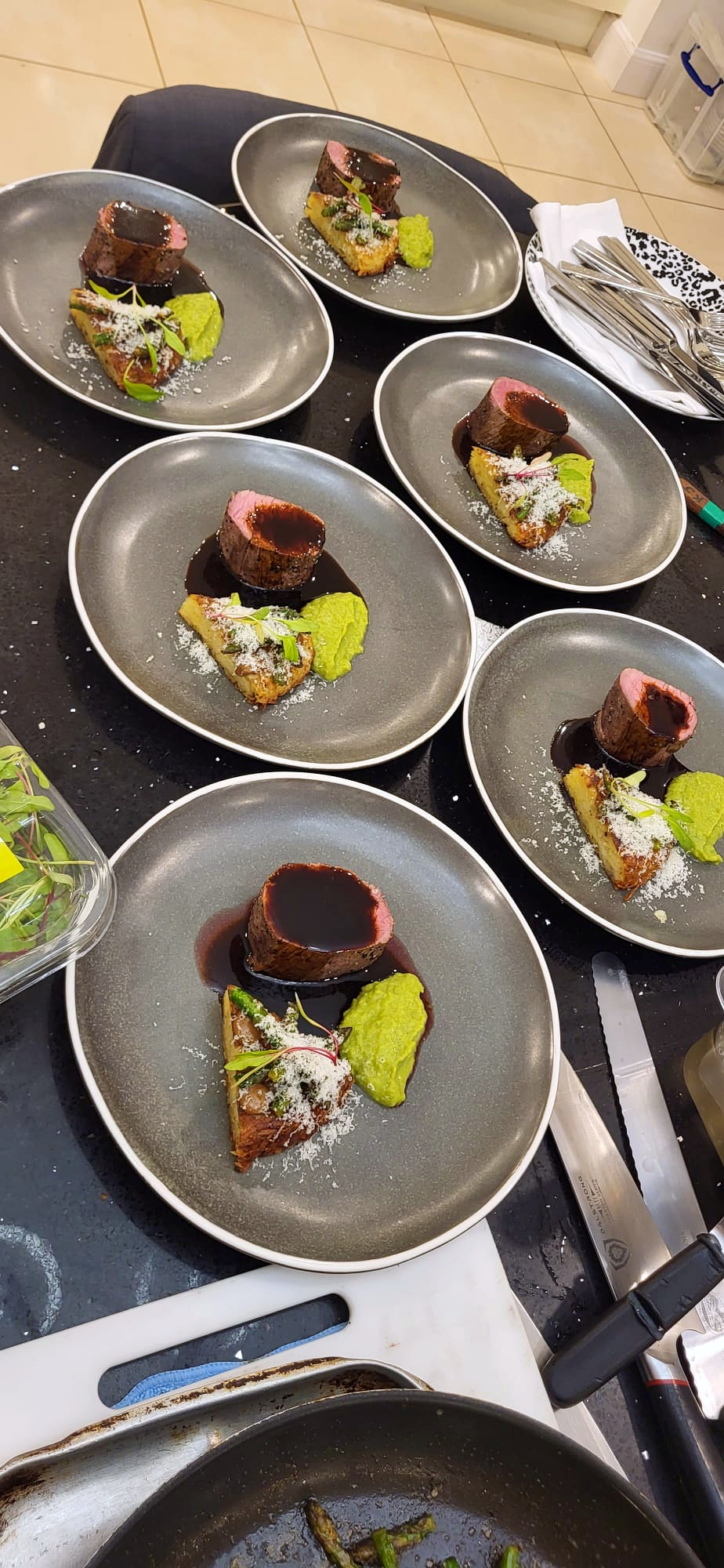 Beef fillet with pea purée and rösti plated for service