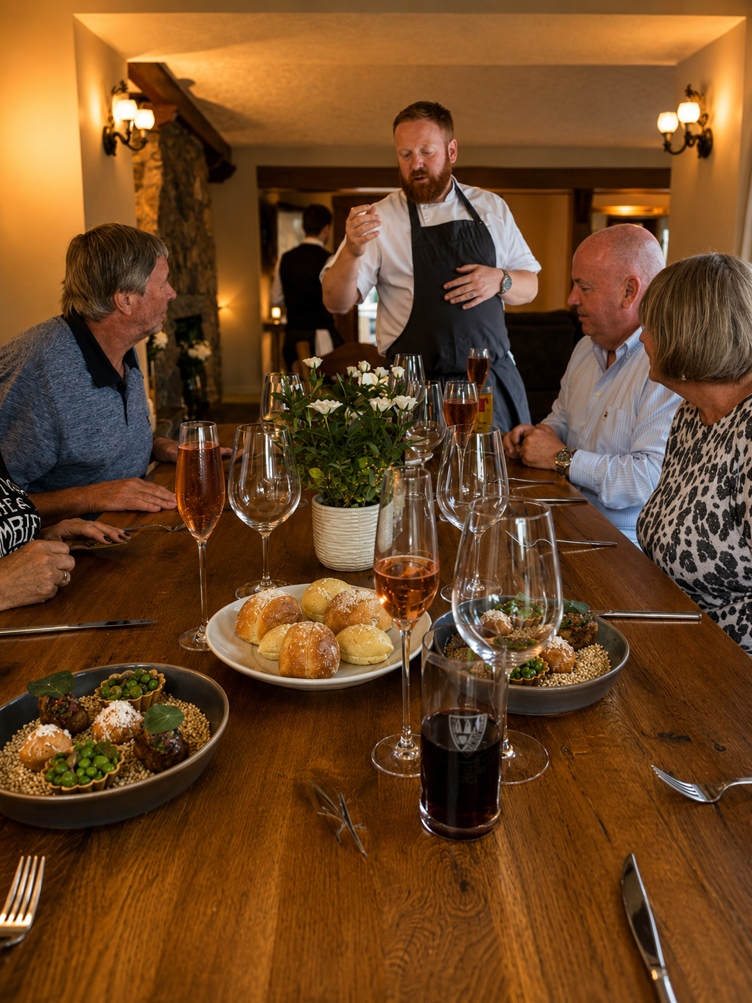 Chef hosting guests at a private dining table